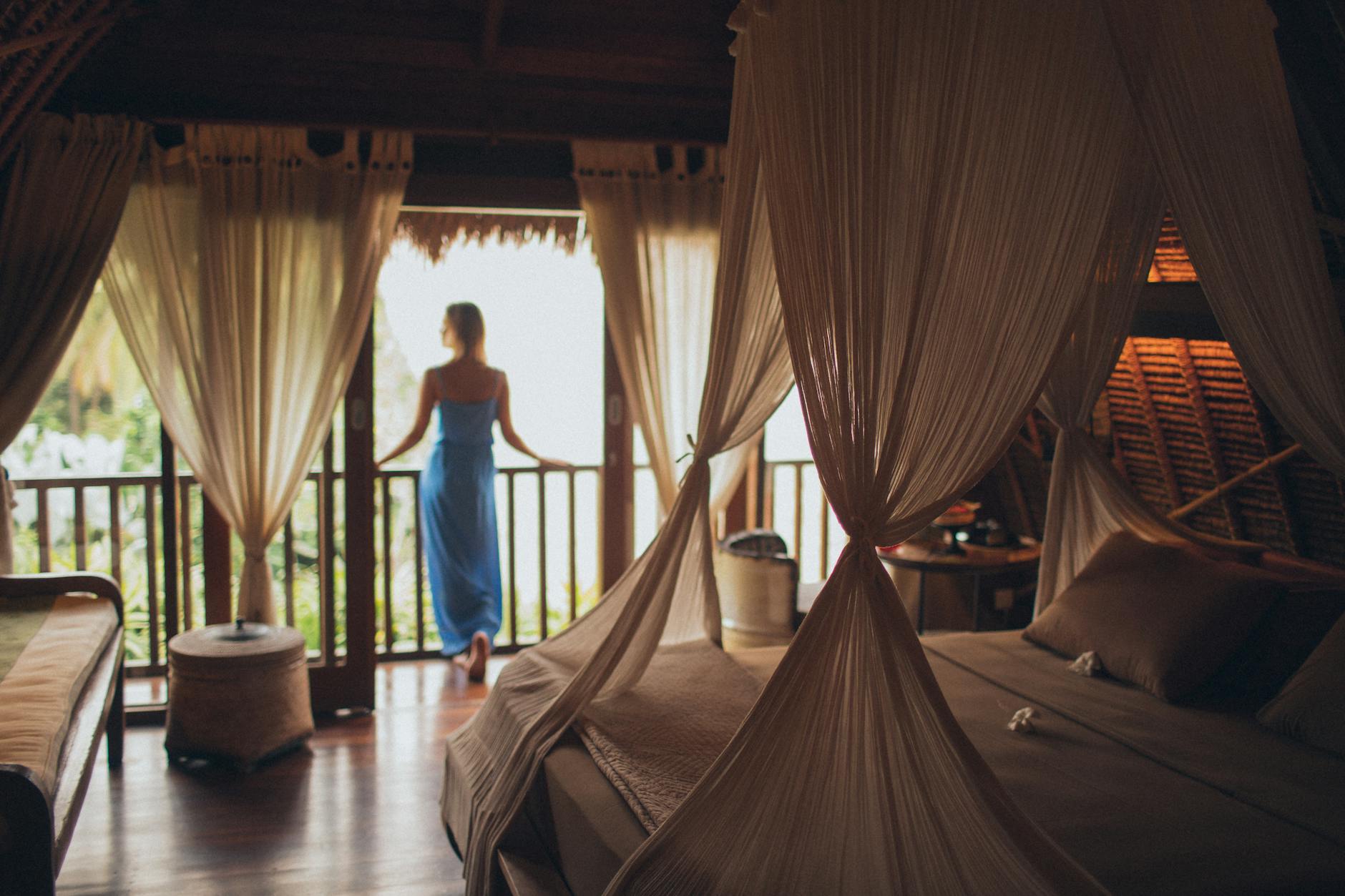 woman leaning on handrail in room